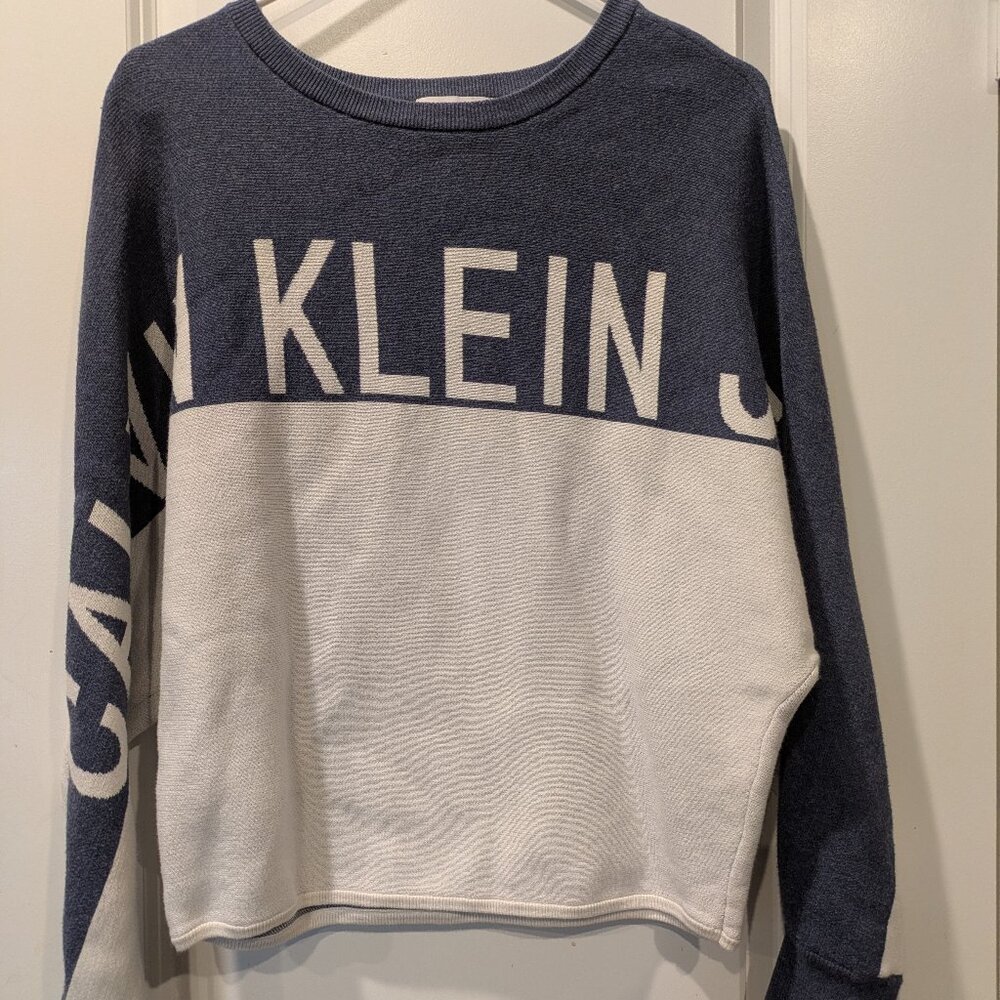 Calvin Klein color-block pullover sweater with the brand name on the front.
